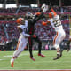 Oct 2, 2022; Atlanta, Georgia, USA; Atlanta Falcons wide receiver Drake London (5) is defended by Cleveland Browns cornerback Martin Emerson Jr. (23) and safety Grant Delpit (22) on an incomplete pass in the first quarter at Mercedes-Benz Stadium. Mandatory Credit: Brett Davis-USA TODAY Sports